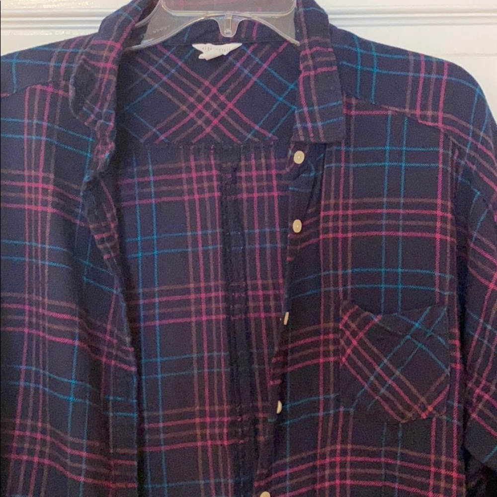 Plaid button down shirt.